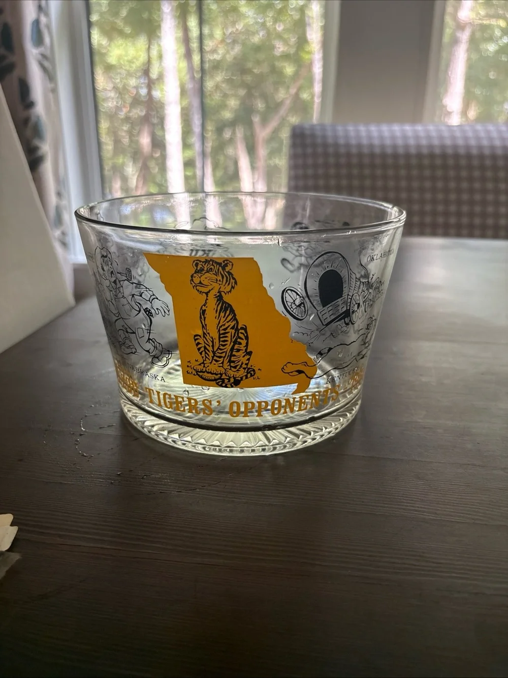 Vintage 1968 Missouri Tigers ice bowl featuring the football opponents